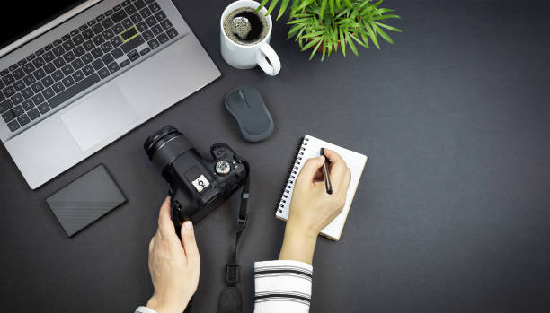 istock Photographer working at home. 1345435258