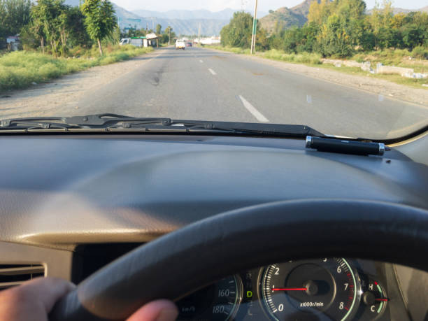 istock Slowly driving a car on a highway 1345436426