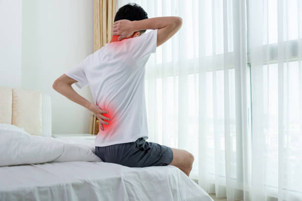 Young man with lower back pain stock photo
