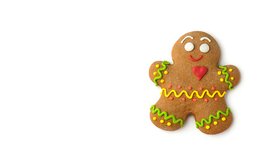Happy gingerbread man isolated on white background. Christmas still life. Copy space.