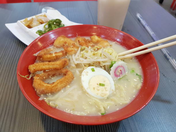 istock Ramen plate with hard-boiled egg and breaded squid rings 1345441179