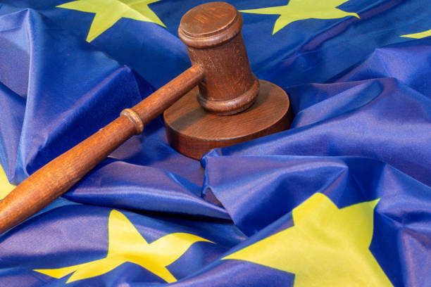 Symbol image: Judges gavel on a flag of the European Union stock photo