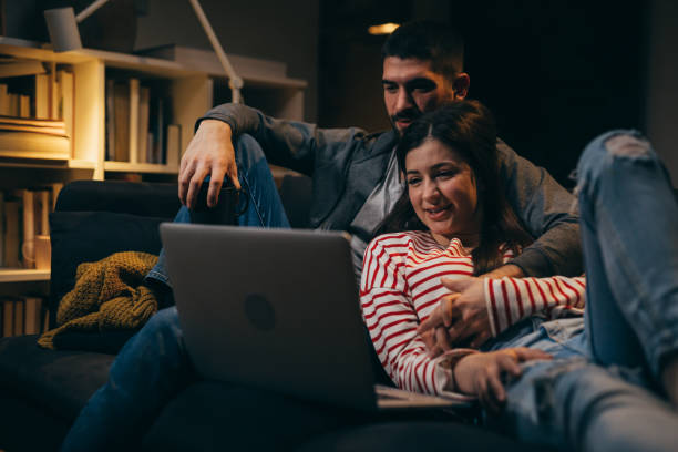 istock happy young couple at home. evening scene 1345443752