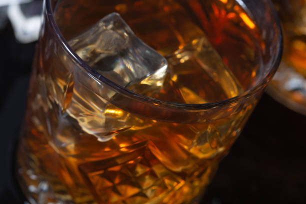 istock whiskey with ice in glasses close-up 1345444535
