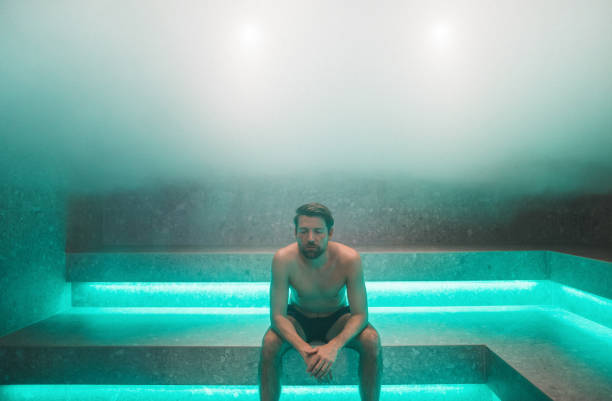 Man in sauna Man sitting in sauna. sauna stock pictures, royalty-free photos & images