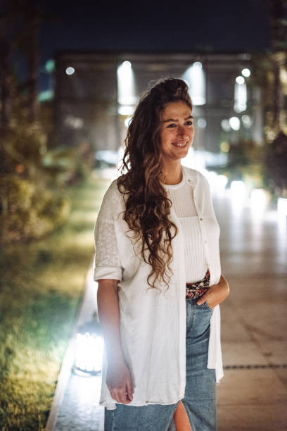 istock elegance woman at night 1345453164