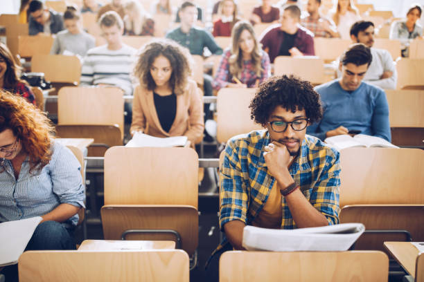 istock African American college student studying on a class at lecture hall. 1345454071