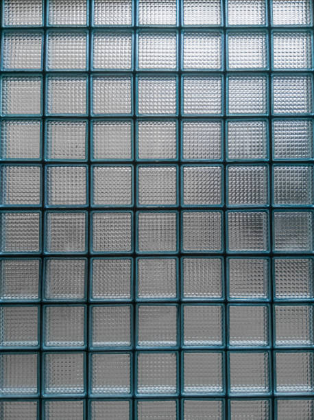 istock The wall is lined with blue glass blocks, textured. 1345454301