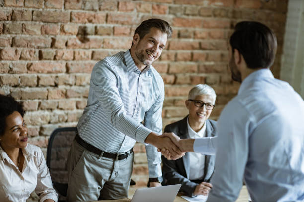 istock Human resource team welcoming a candidate on a job interview. 1345454710