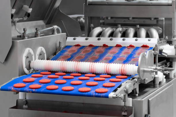 istock Sweets factory. Sweets production process. Conveyor belt with sweets on it. 1345454786