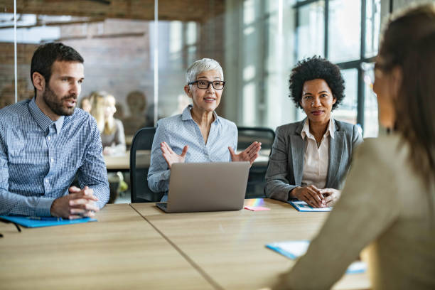 istock Human resource team talking to their candidate on a job interview. 1345455044