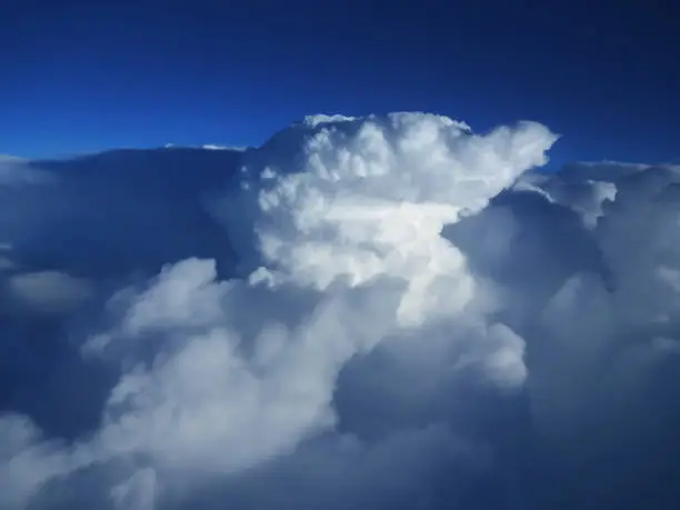 Amazing clouds against a blue sky - the view of the clouds from the plane