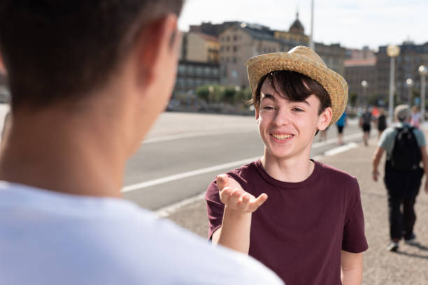 istock Teenage boy talking with friend. 1345460789
