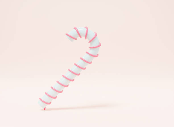 istock Realistic Christmas candy cane striped on pink pastel background 1345460861