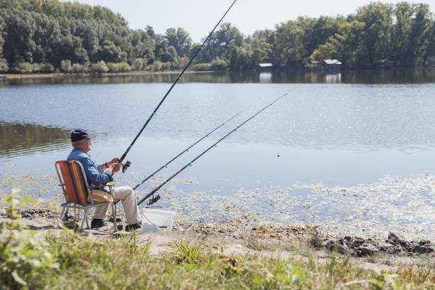 istock Elderly man fishing 1345461370