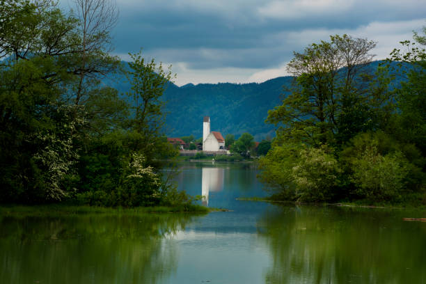 White church on lake Forggensee White building on lake Forggensee, Fuessen, Bavaria, Germany forggensee lake photos stock pictures, royalty-free photos & images
