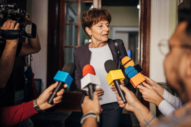 istock Female politician talking to the press 1345462230