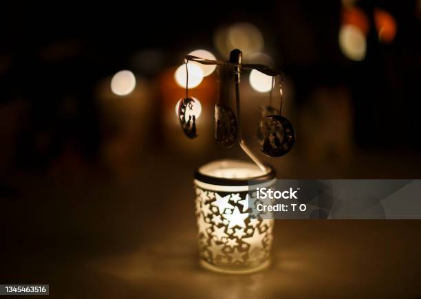 Cats On A Rotating Goround Carousel Candle Holder In A Dark Room Stock Photo - Download Image Now