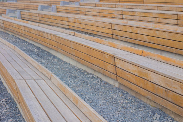 istock wooden benches stand in a semicircle on the stones 1345463786