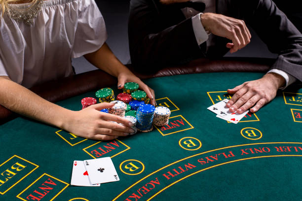 istock couple playing poker at the table 1345465531