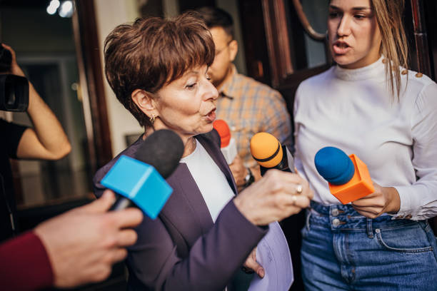 istock Female politician talking to the press 1345465593