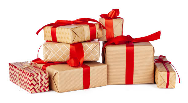 istock Gift boxes wrapped in craft paper isolated on white background 1345467830