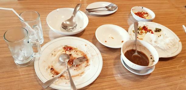 istock Empty dirty plate after delicious lunch meal and drinks 1345467951