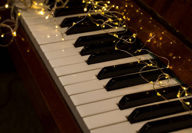 istock Piano keyboard with garland lights 1345468206