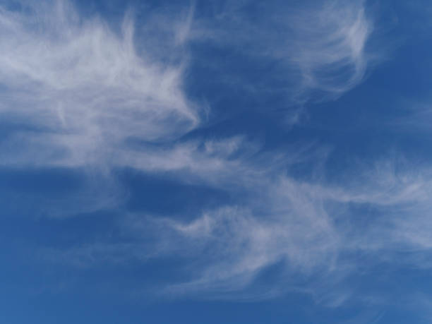 White Wispy Clouds with Blue Sky September Day Background stock photo