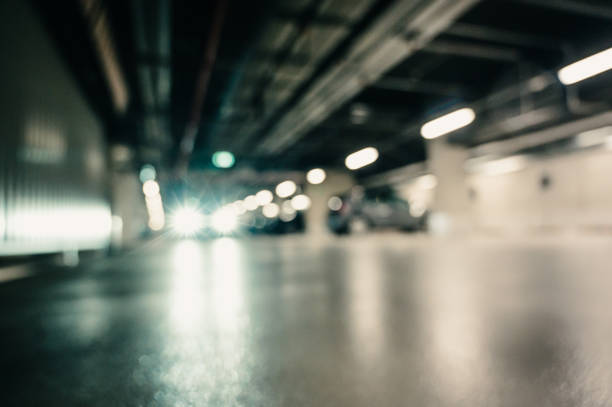 istock Moving Car in Parking Garage 1345470985