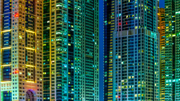 istock contemporary skyscrapers with illuminated windows at night 1345471162