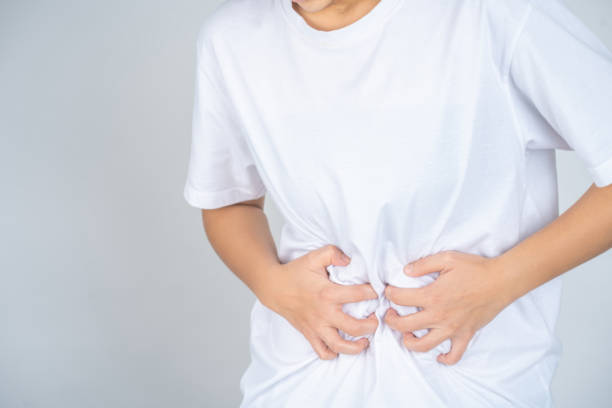 istock Concept. Belly hurts against white background. 1345472377
