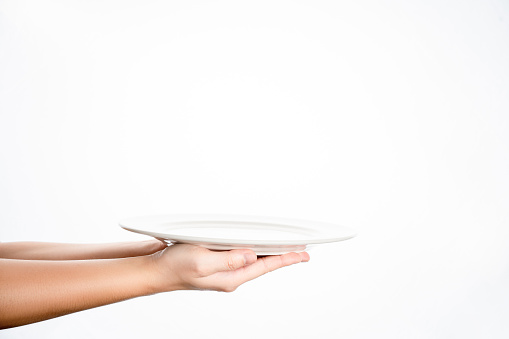 White dish empty in hand pattern on white background isolation, with copy space.