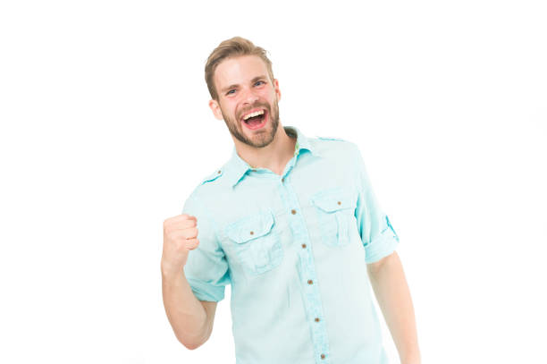 Cheerful man walking with arms outstretched in nature on beautiful spring day.