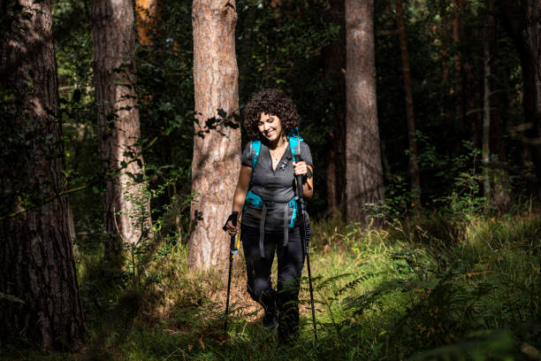 istock Girl trekking with her backpack 1345475105