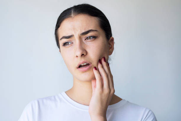 istock Young woman with toothache 1345475149