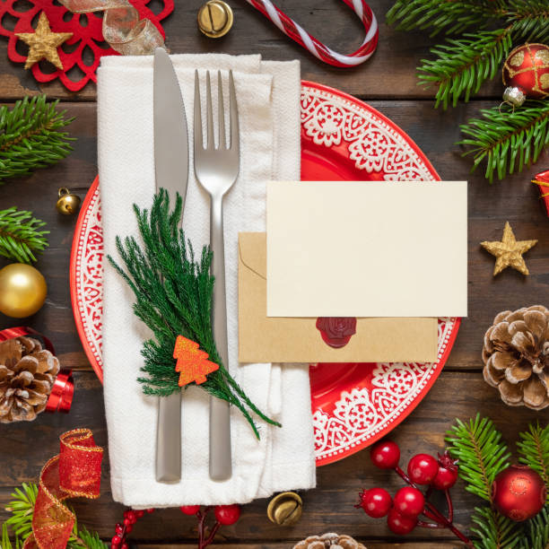 istock Festive table setting with Christmas decorations. Card and envelope mockup 1345476287