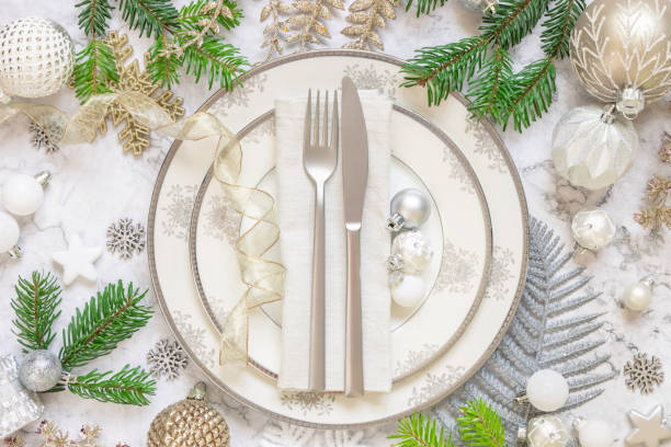 istock Festive table setting with fir tree branches and Christmas decorations 1345476292