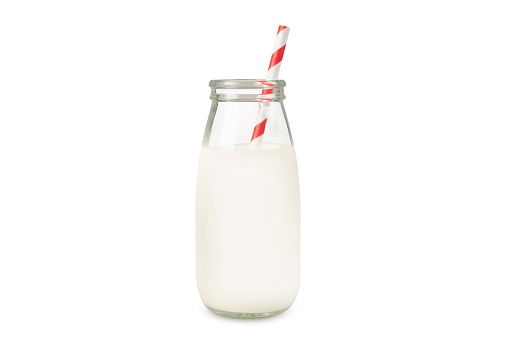 Bottles of milk with red straws