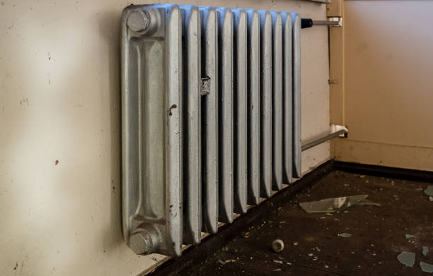 istock Old radiator in a room 1345481754