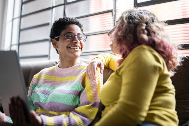 istock Young women using a digital tablet at home 1345484882