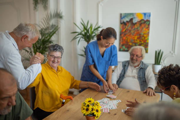 istock Senior people having fun playing games in retirement home 1345484961