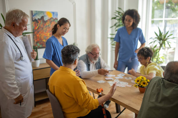 istock Senior people having fun playing games in retirement home 1345485559