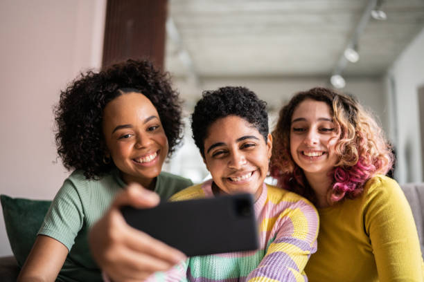 istock Friends watching something or on a video call on a mobile phone at home 1345487633