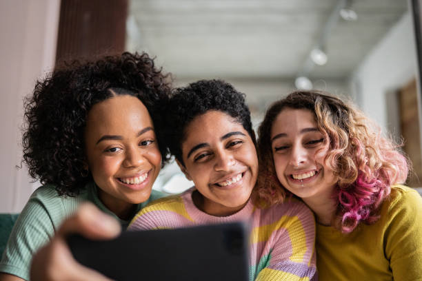 istock Friends watching something or on a video call on a mobile phone at home 1345487732