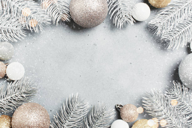 istock Christmas background with frosted Christmas tree branches and baubles 1345487838