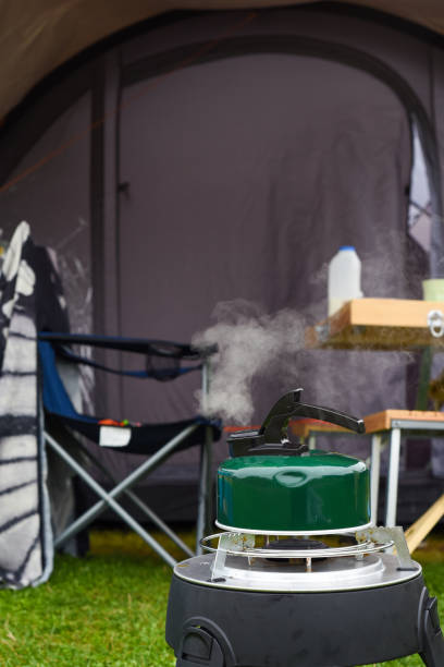istock Boiling a kettle outside a tent on a campsite in the morning 1345488046