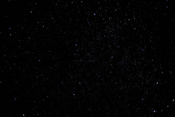 istock Starry sky background with bright stars in dark night sky 1345488192