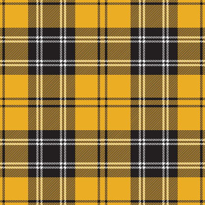 Scottish yellow, black and white tartan plaid pattern, fabric swatch close-up.