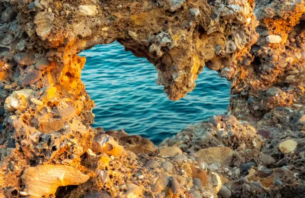 The beautiful coastal rocks with a heart-shaped hole